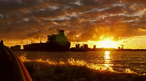 Nice sundown in port when a ship is sailing to the jetty, 4k shot. Stock Footage 66201934