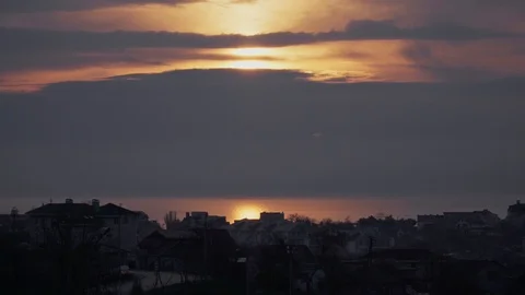 Nice sunrise among the clouds over the ocean or sea Stock Footage 107071495