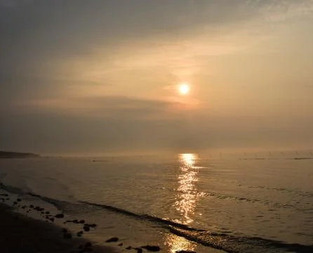 Nice sunrise in the ocean ,while seeing it from the beach,a very calm situati Stock Photos
