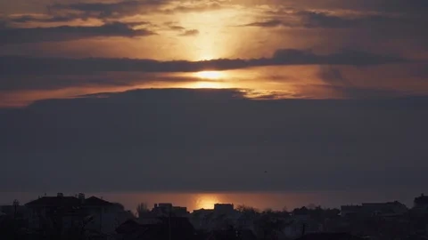 Nice sunset among the clouds over the ocean or sea Video stock 107071513