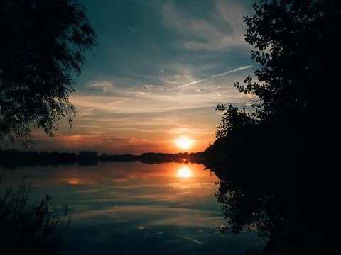 Nice sunset with clouds, in orange and purple shades Stock Photos