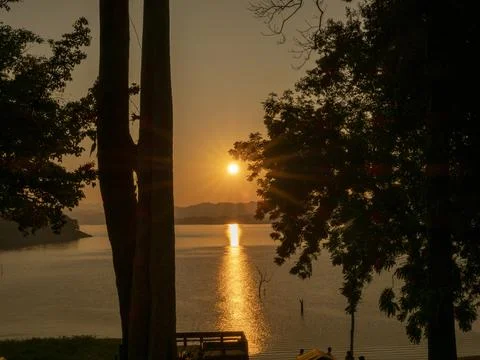 Nice sunset in a dam area Stock Photos