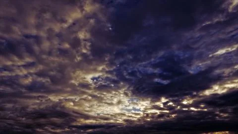Nice sunset goldish clouds on the sky backdrop - photo of nature Stock Photos