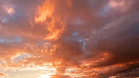 Nice sunset goldish clouds on the sky background - photo of nature Stock Photos