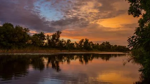 Nice sunset landscape on river Stock Photos