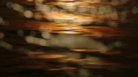 Nice sunset reflected on sea wave overlay with blurred bokeh light Stock Footage 75942954