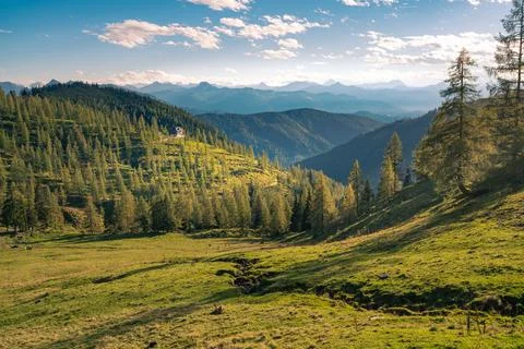 Nice sunset in the vast Alpine valley under the Hoher Dachstein massif on a Stock-Fotos