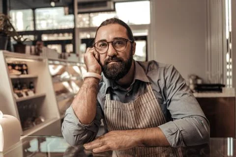 Nice thoughtful man thinking about his business Foto stock