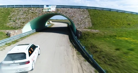 Nice tracking drone shot of racing car in tunnel Stock Footage 89416659