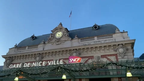 Nice train station (Gare de Nice Ville) building. French flag is waiving. France 库存影片 264101289