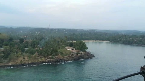 Nice view of the bay and palm trees from the top of the lighthouse in Dondra Stock Footage 71609592