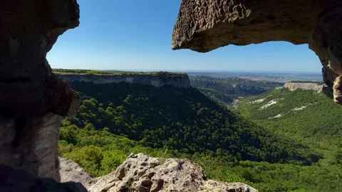 Nice view from the cave to the green valley and mountains. Stock Footage 165210839