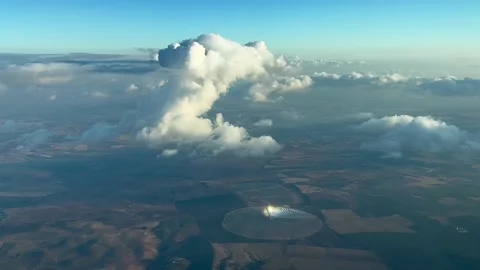 Nice view from a jet cockpit of a tiny cumulus ahead overflying a rounded Stock Footage 212383685