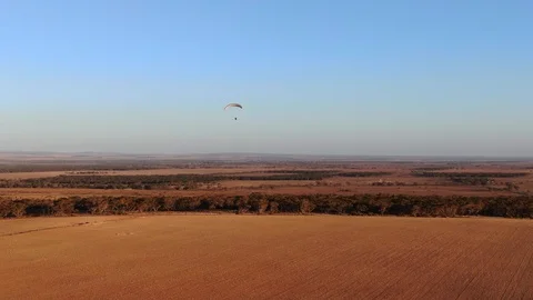 Nice view of parachutist paramotoring enjoying flying in the air Stock Footage 115509340