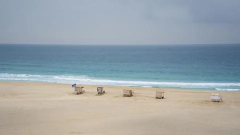 Nice view of sandy beach blue ocean and shops on the beach 写真素材