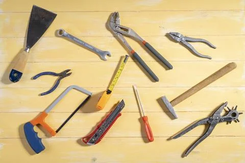 Nice view of tools for work in the home on yellow wooden background Stock Photos