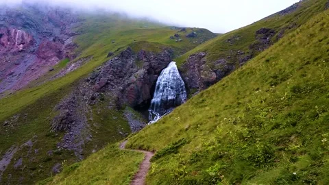 Nice view of the waterfall in the mountains of the North Caucasus. Stock Footage 158820951