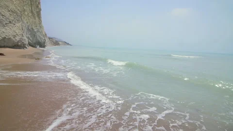 Nice view, the waves crashing against the rock on the sea shore Stock Footage 140147306