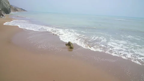 Nice view, the waves crashing against the rock on the sea shore Stock Footage 140147317