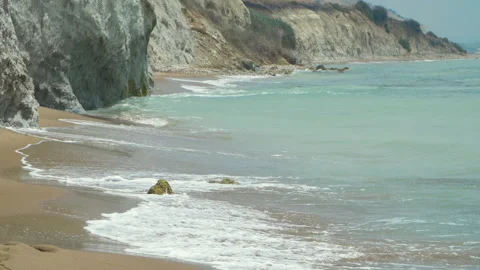 Nice view, the waves crashing against the rock on the sea shore Stock Footage 140147833
