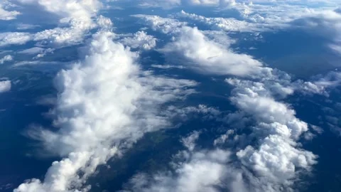 Nice view from the window of the plane to the blue sky, white clouds Stock-Footage 139745422