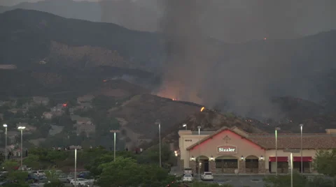 Nice water drop behind sizzler restaurant (Sand Fire at Fair Oaks) Stock Footage 65767958