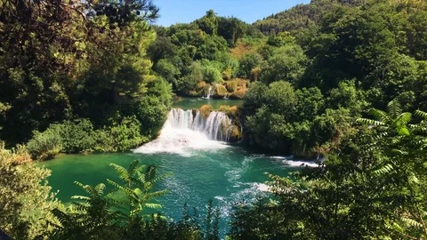 Nice waterfall and river on warm summer day at Krka National Park Croatia Stock Footage 82703925