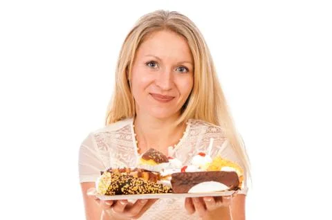 The nice woman with cakes Stock Photos