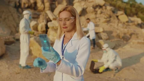 Nice Woman Ecology Expert Using Smartphone Browsing Holographic Models of Solar Stock Footage 137821868