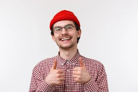 Nice work, good job mate. Supportive cute caucasian male in glasses and red Stock Photos