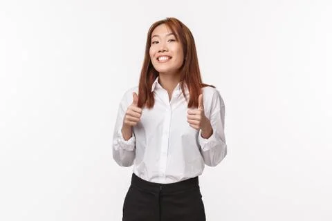 Nice work, you doing great sweetie. Cheerful and encouraging asian girl rooting Stock Photos