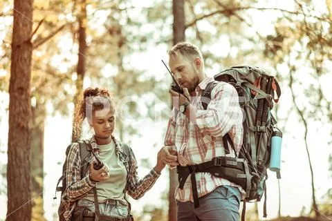 Nice young couple being lost in the forest Stock Photos
