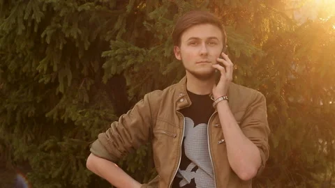 Nice young man talking on mobile phone Video stock 100227749