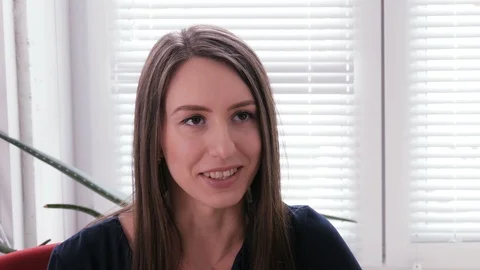 A nice young secretary talking to someone in an office Stock Footage 87086841