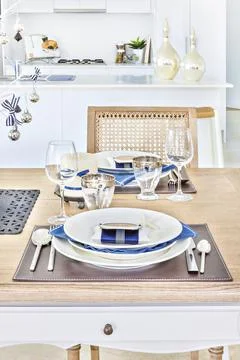 Nicely arranged dining table with ceramics. Stock Photos