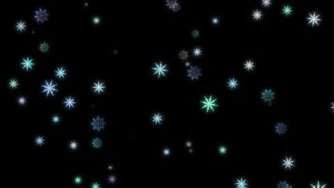 Nicely colored snowflakes appear and disappear against a black background. Stock Footage 135581026