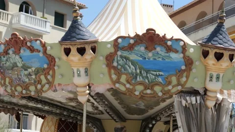Nicely decorated old carousel that is moving. Old amusement park attraction. Stock Footage 204922439