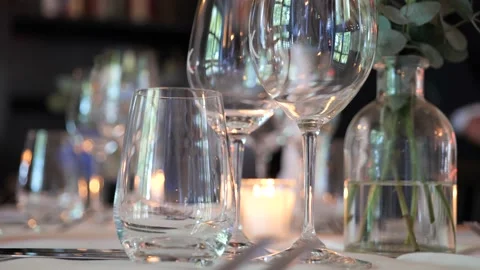 Nicely decorated table at a wedding dinner with reflection in the glasses. Stock Footage 195121301