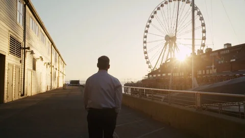 Nicely dressed man walks by downtown Seattle Lake Front Stock Footage 90060042