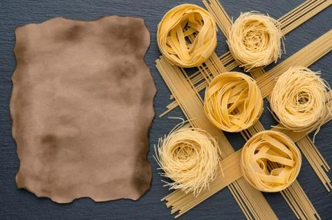 Nicely spread pasta and spaghetti. Aged paper sheet. Can be used for menus. Stock Photos