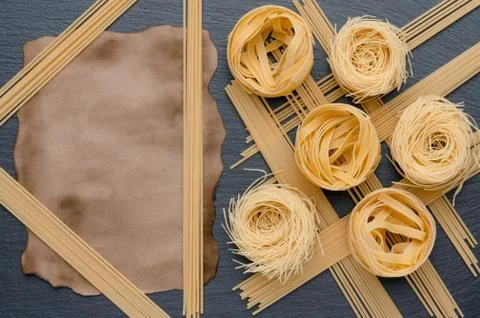 Nicely spread pasta and spaghetti. Aged paper sheet. Can be used for menus. Stock Photos