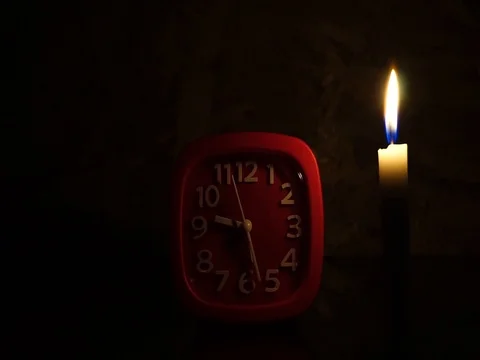 Nick of time by candlelight and clock ticking Stock Footage 82304410