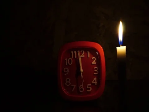 Nick of time by candlelight and clock ticking Stock Footage 82304468