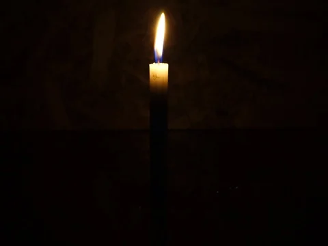 Nick of time by candlelight in the darkness Stock Footage 82304576