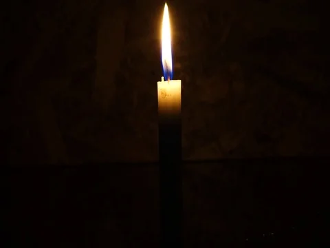 Nick of time by candlelight in the darkness Stock Footage 82304617