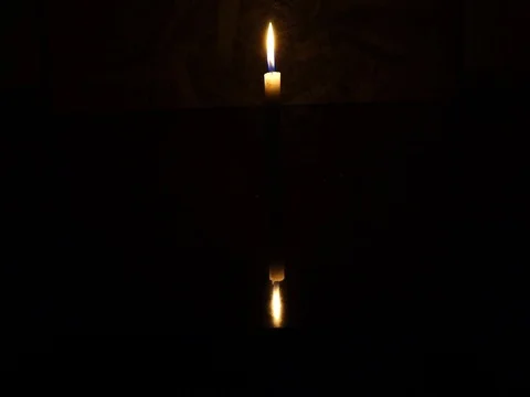 Nick of time by candlelight in the darkness Stock Footage 82304651