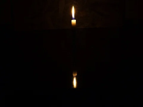 Nick of time by candlelight in the darkness Stock Footage 82304707