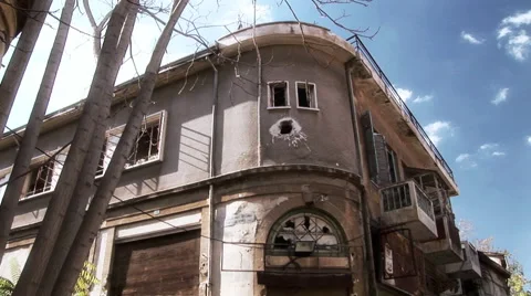 Nicosia Cyprus Green Line - buffer zone building with mortar hole Stock Footage 61206775