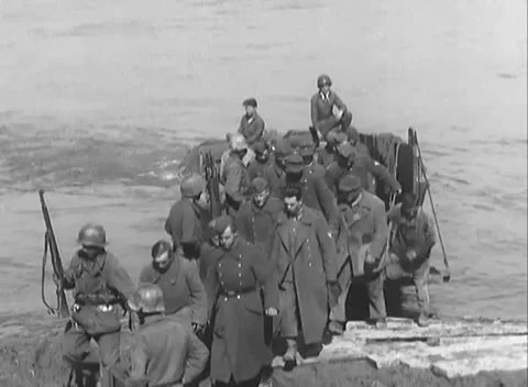 NIERSTEIN, GERMANY - 1945: Loading at the shore - Soldiers climb a packed craft Stock Footage 344598742