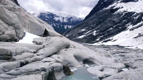 Nigardsbreen glacier stream in Norway Stock Footage 230226017
